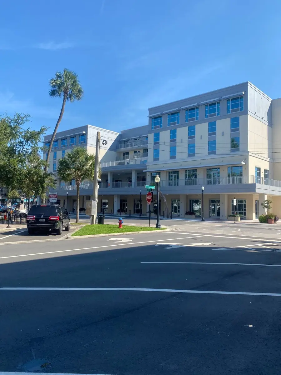 Multi-story hotel with glass storefronts