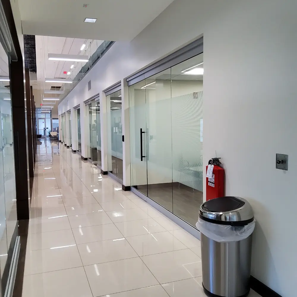 Office corridor with glass-walled rooms