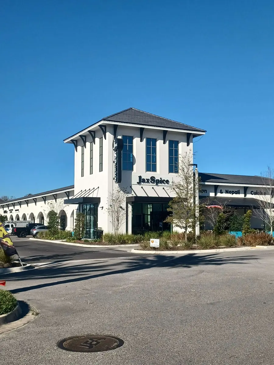 Retail building with a glass tower entrance